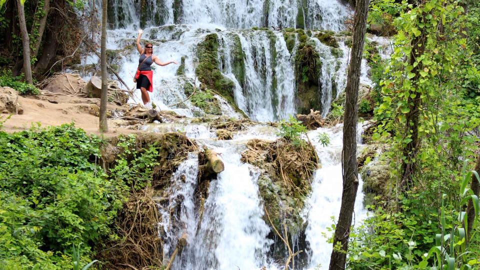 Dee Caffari next to a Waterfall in Croatia